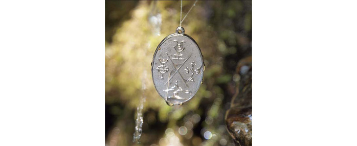 Elementarni kovanec ali amulet v darilni vrečki - Kuponko.si